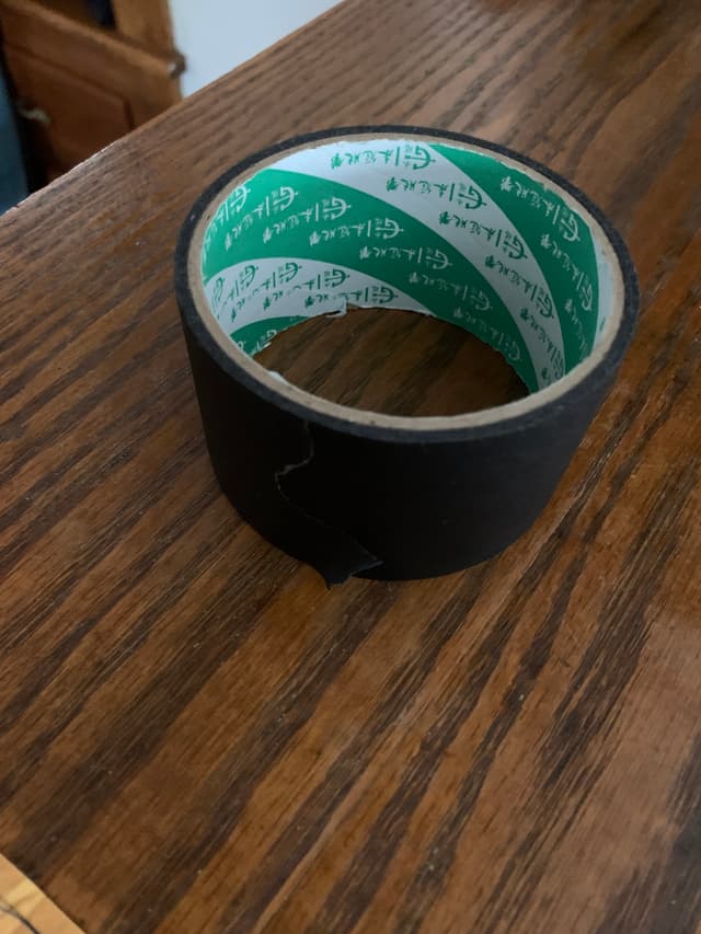 Roll of black adhesive tape